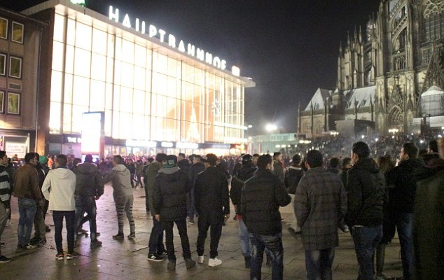 Hundreds of people gather in front of Cologne's main railway station, where disorder broke out last week and groups of 'Arab or North African' men attacked dozens of women